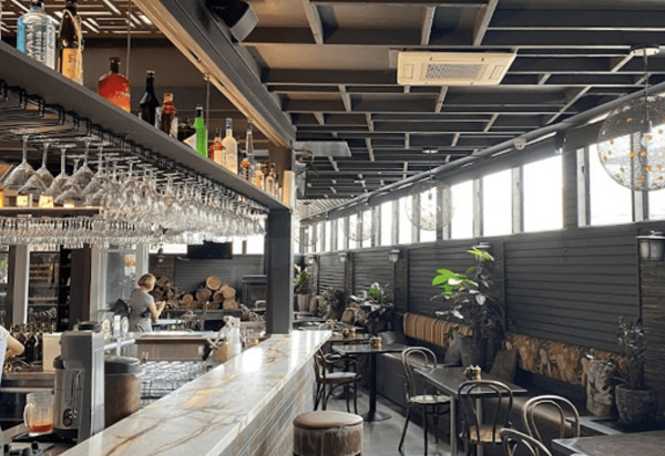 Bar seating inside Goat House Restaurant